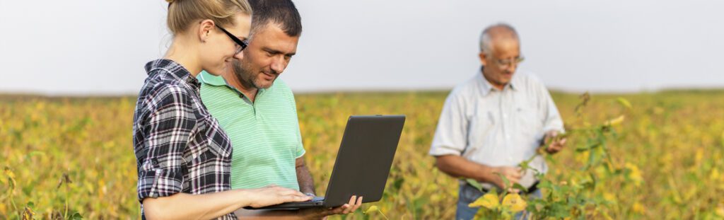 agent careers banner farmers in field with laptop